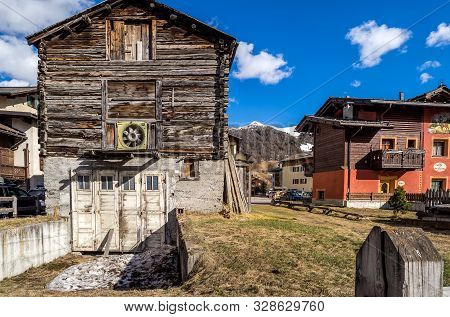 Livigno, Italy, April 2016 Old Traditional Alpine Wooden Architecture In The Village, Wooden House, 