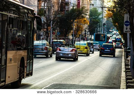 Car Traffic At Rush Hour In Downtown Area, Victoriei Boulevard (calea Victoriei) In Bucharest, Roman