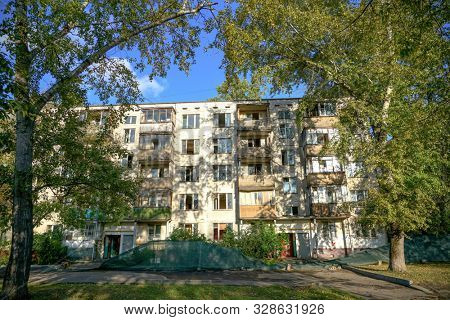 Moscow, Russia - August 2019: Fivestory house falling under renovation. Evicted five story building in Maryina Roshcha.