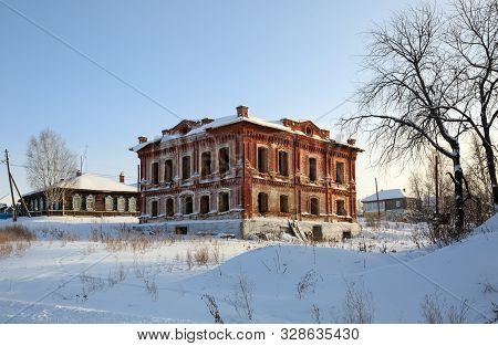 Abandoned Historical Residential House On A Sunny Winter Day. Village Of Visim, Sverdlovsk Region, L