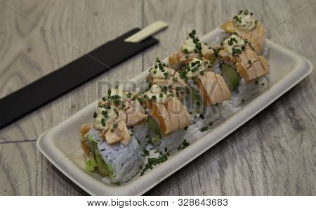 Japanese Uramaki Sushi. Bebi Roll Rice Rolls Stuffed With Tempura Shrimp, Avocado, Chopped Lettuce, 