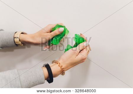 Slime, Green Pate Elastic And Vicous On Childs Hand.