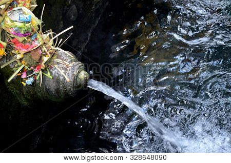Holy Water Originating From A Volcanic Spring At Tirtha Empul Temple In Bali Indonesia.