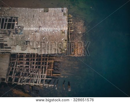 Cemetery Of Old Ships In Teriberka Murmansk Russia, Dramatic Photo. Aerial Top View