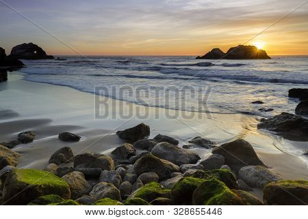 Pacific Ocean Beach Sunset With Seal Rocks Viewed From The Sutro Baths. San Francisco, California, U