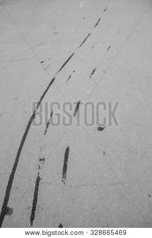 Aerial Top View Background With Skid Tire Marks On Race Track.