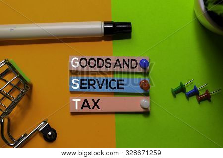 Gst. Goods And Service Tax Acronym On Sticky Notes. Office Desk Background