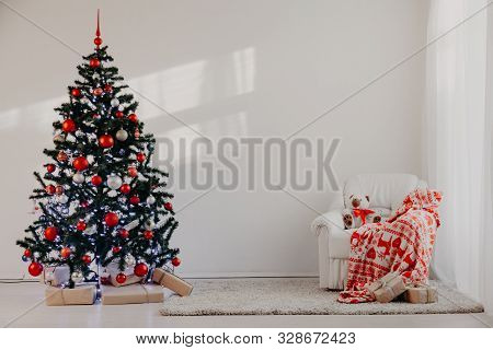 Christmas Tree In A White Room For Christmas With Gifts