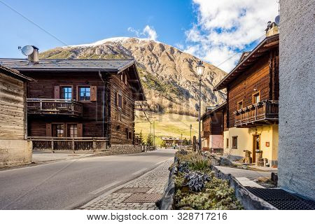 Street View On Traditional Alpine Wooden Architecture In The Village, Wooden House, Livigno Is A Sma