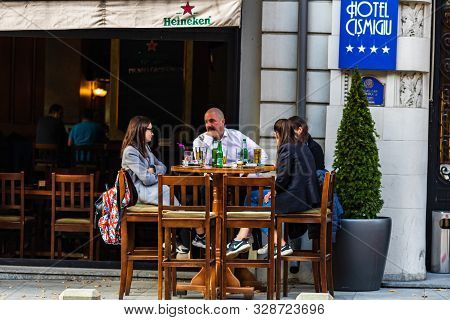 Tourists Having Beers At Gambrinus Bar In Old Town Of Bucharest, Romania, 2019