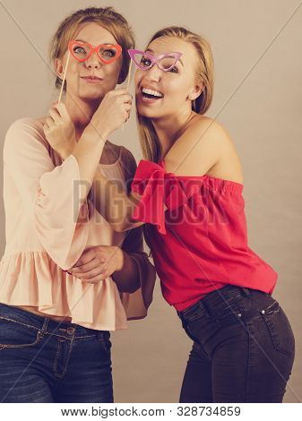 Happy Two Women Holding Paper Decoration Photo Booth Mask Glasses On Stick, Having Fun. Wedding, Bir