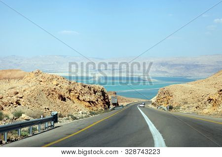 Deadseaview On A Curvy Sandy Road On A Highway That Runs Along The Dead Sea From One Side And Edom M