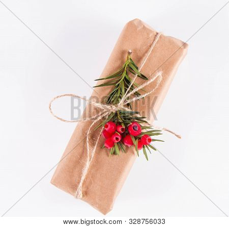 Gift Decorated With A Gunny String Bow And With A Common Yew Twig