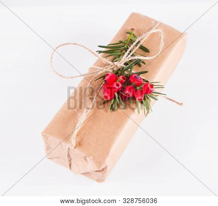 Gift Decorated With A Gunny String Bow And With A Common Yew Twig