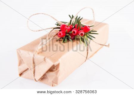 Gift Decorated With A Gunny String Bow And With A Common Yew Twig