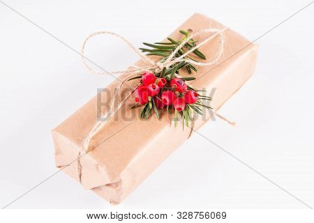 Gift Decorated With A Gunny String Bow And With A Common Yew Twig