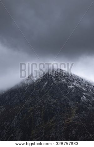 Stunning Detail Landscape Images Of Snowcapped Pen Yr Ole Wen Mountain In Snowdonia During Dramatic 
