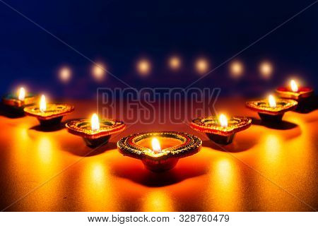 Indian Festival Diwali, Diya Oil Lamps Lit On Colorful Rangoli. Hindu Traditional. Happy Deepavali.