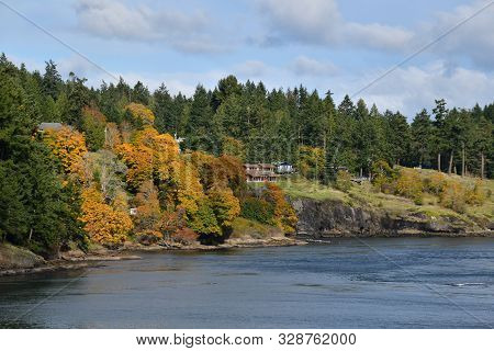 Cliffside Houses Surrounded By Beautiful Autumn Colors And Evergreens.
  Bc Canada