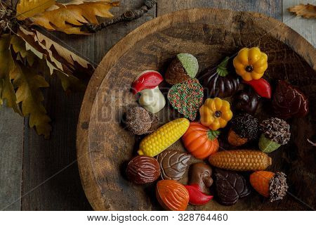 Autumn Chocolate Bonbon On A Wooden Dish