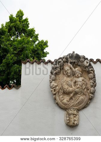 A Relief Of Madonna And Child On A White Wall In Schlanders (south Tyrol, Italy)