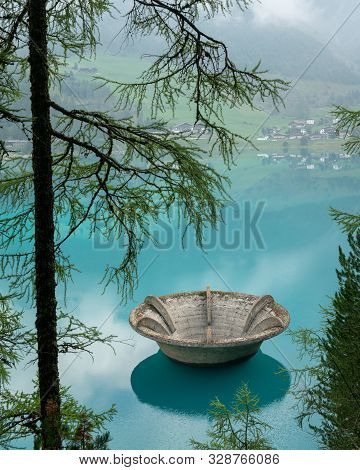 The Lake Vernagt-stausee (schnalstal, South Tyrol, Italy) On A Misty Morning In Summer. The Water Of
