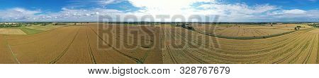 Aerial Drone Wide Panoramic View On Damaged Wheat Field After Wind Storm, Rural Landscape Divided In