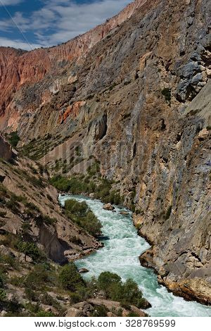 Tajikistan. The Pamir Highway. Panorama Of The Mountain River Iskanderdarya Flowing From Lake Iskand