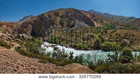 Tajikistan. The Pamir Highway. Panorama Of The Mountain River Iskanderdarya Flowing From Lake Iskand