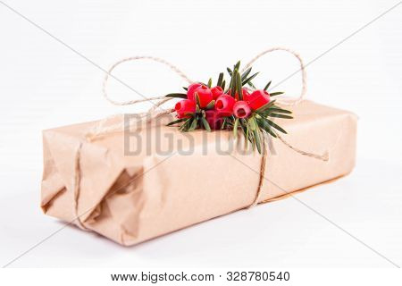 Gift Decorated With A Gunny String Bow And With A Common Yew Twig
