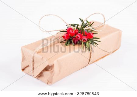 Gift Decorated With A Gunny String Bow And With A Common Yew Twig