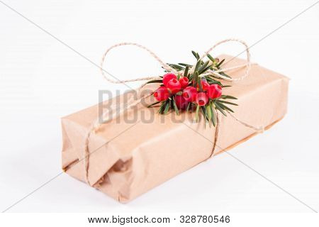 Gift Decorated With A Gunny String Bow And With A Common Yew Twig