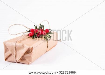 Gift Decorated With A Gunny String Bow And With A Common Yew Twig