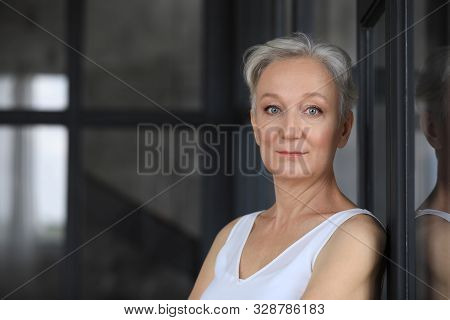 Portrait Of Happy Mature Woman Indoors, Space For Text. Smart Aging