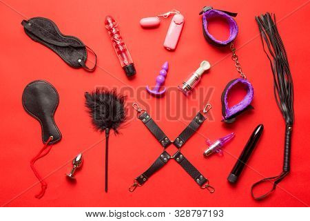 Bdsm Kit From Sex Shop. Leather Whip, Buttplug, Vibrator, Handcuffs, Dildo, Nipple Clamps And Other 