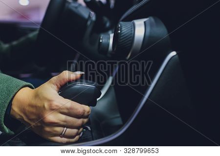 Close Up Of Woman Shifting Gears On Gearbox In Car.