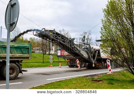 Valasske Mezirici, Czech Republic, 23 April 2019: Road Repair. Milling Machine Removes Old Asphalt F