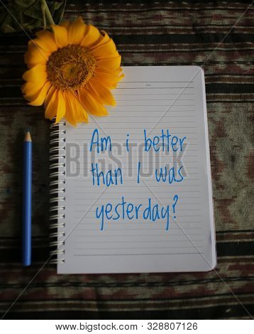 Inspiratonal Motivational Quote - Am I Better Than I Was Yesterday.  Notes On White Paper Notebook W