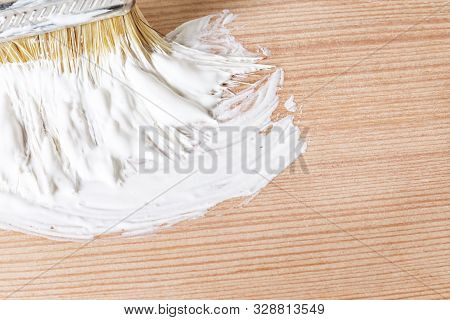 A Smear Of White Paint On A Wooden Board. Color Sample For Design In Hugg Style. Light Wooden Boards