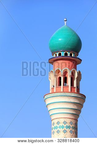 Minaret of Friday Mosque on blue sky background, Ardabil, Iran