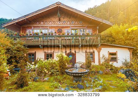 Altai, Russia - 08.01.2019: A Small Cute House Outside The City For Summer Living And Outdoor Recrea