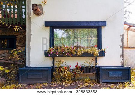 White Wall Of Small Old House For Summer Living And Outdoor Recreation Around Which There Is A Beaut