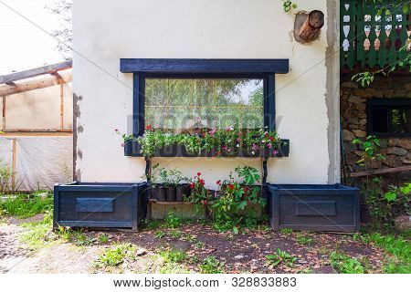 White Wall Of Small Old House For Summer Living And Outdoor Recreation Around Which There Is A Beaut