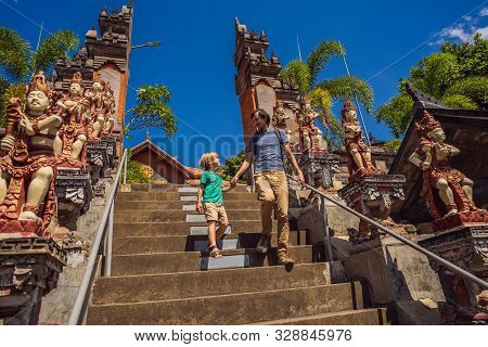 Dad And Son Tourists In Budhist Temple Brahma Vihara Arama Banjar Bali, Indonesia