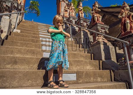 Young Boy Tourist In Budhist Temple Brahma Vihara Arama Bali