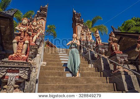 Young Woman Tourist In Budhist Temple Brahma Vihara Arama Bali