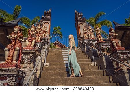 Young Woman Tourist In Budhist Temple Brahma Vihara Arama Bali