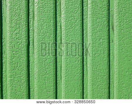 Green Paint Cracked. In Sunny Weather The Iron Gate. Vertical Lines