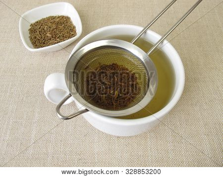 Tea From Caraway Seeds And Caraway Fruits In The Tea Strainer