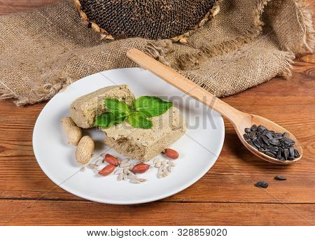 Crumbly Sunflower Halva With Peanuts Addition, Separately Mint Leaves, Sunflower Seeds, Peanuts On D